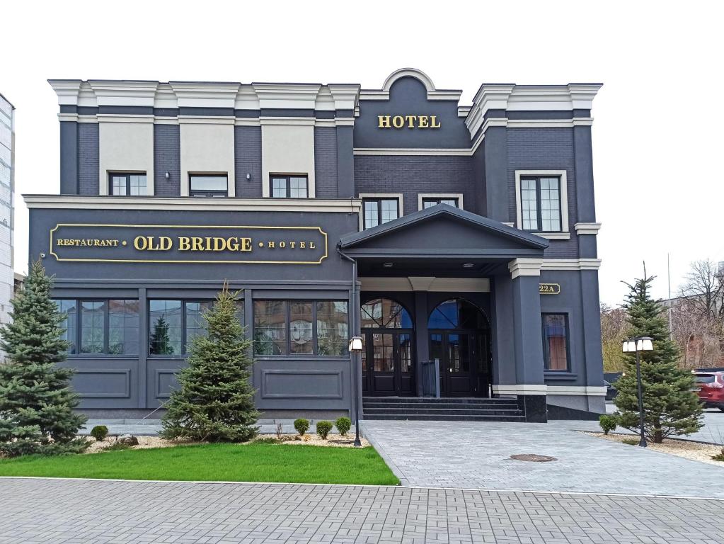 a hotel with the front of the building at Old Bridge in Dnipro