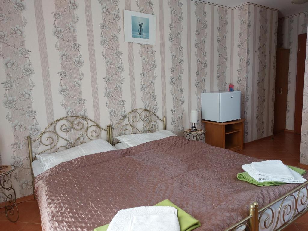 Postel nebo postele na pokoji v ubytování Willa Secesja