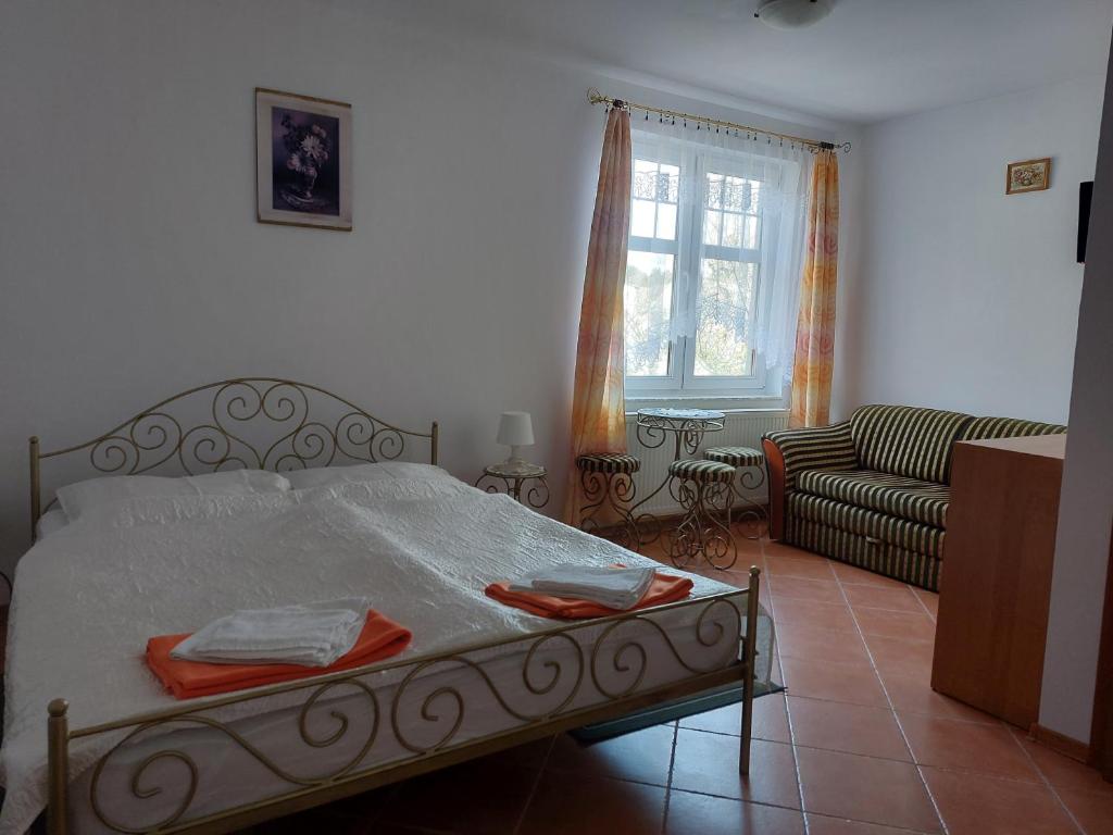 Postel nebo postele na pokoji v ubytování Willa Secesja