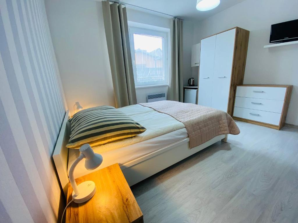 Postel nebo postele na pokoji v ubytování Villa Horyzont