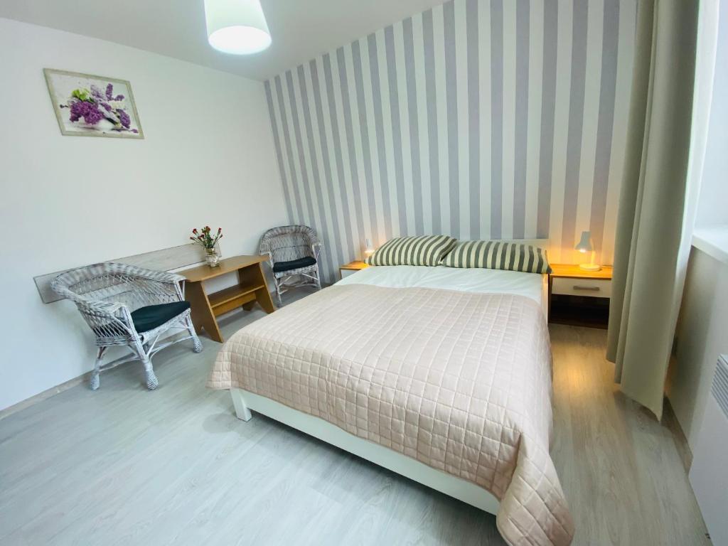Postel nebo postele na pokoji v ubytování Villa Horyzont