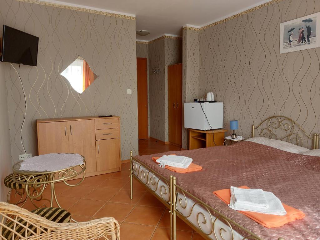 Postel nebo postele na pokoji v ubytování Willa Secesja