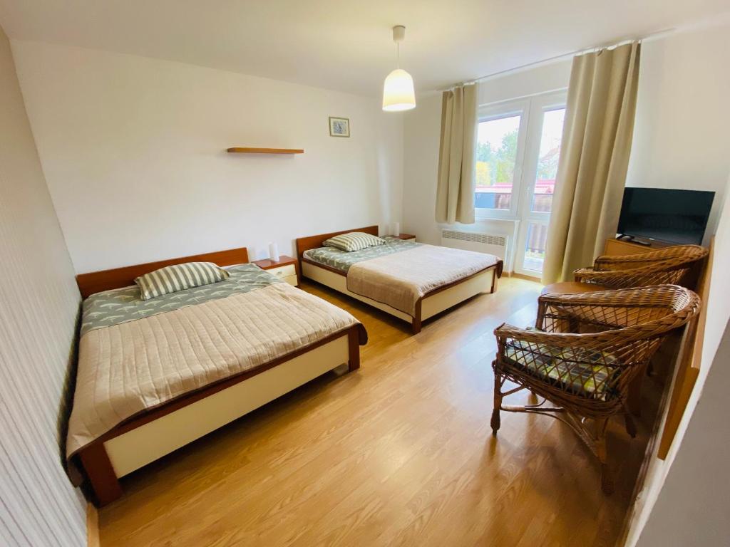 Postel nebo postele na pokoji v ubytování Villa Horyzont
