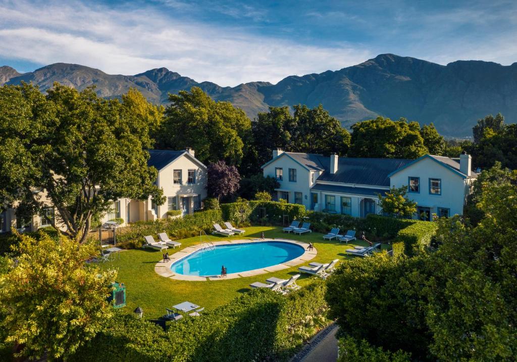 an aerial view of a house with a swimming pool at Le Quartier Francais in Franschhoek