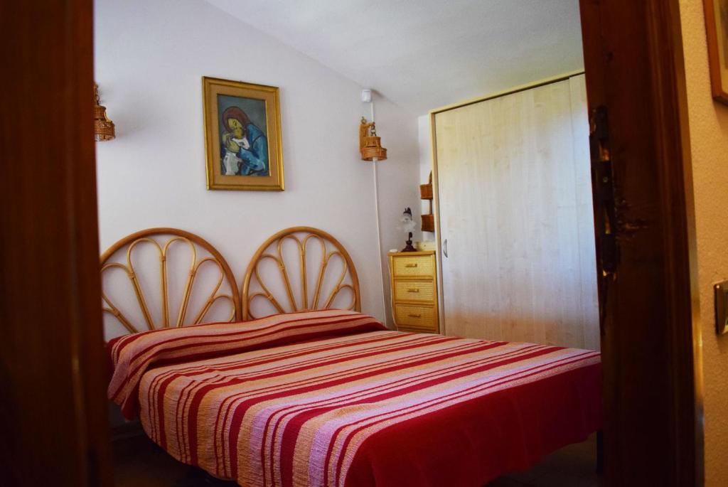 A bed or beds in a room at Villa azzurra tra le coste del sud