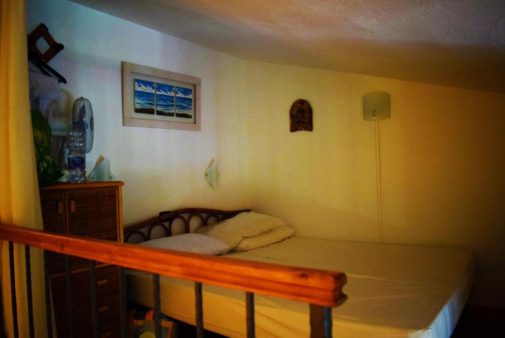 A bed or beds in a room at Villa azzurra tra le coste del sud