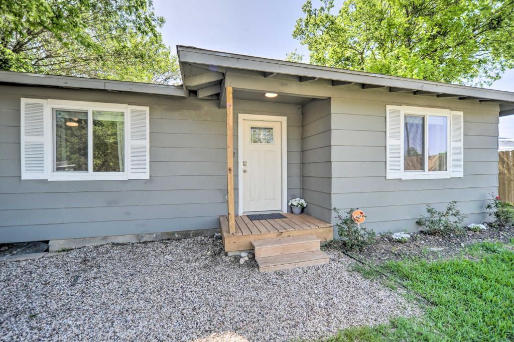 a tiny house with a porch and a door at San Marcos Cottage with Large Private Backyard! in San Marcos