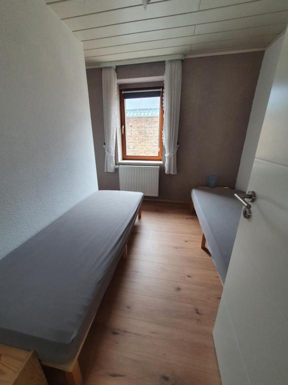 Postel nebo postele na pokoji v ubytování Ferienwohnung Hofmann