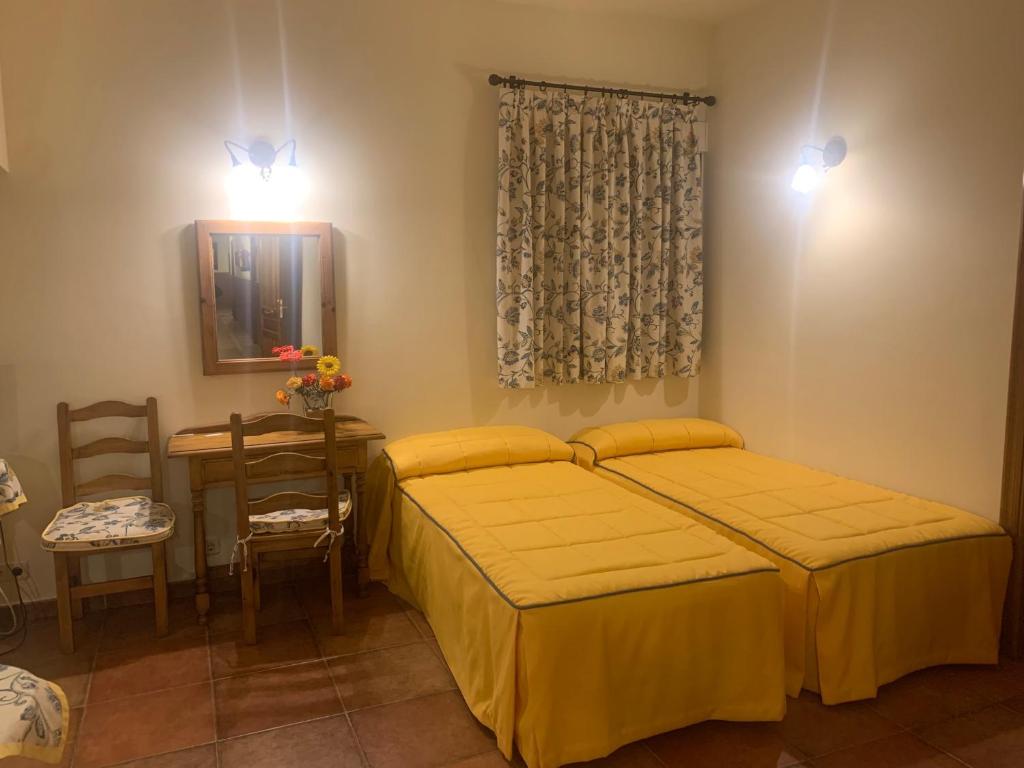 Postel nebo postele na pokoji v ubytování Hotel Langa