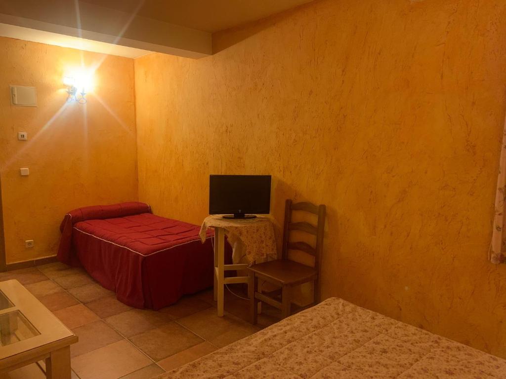 TV a/nebo společenská místnost v ubytování Hotel Langa
