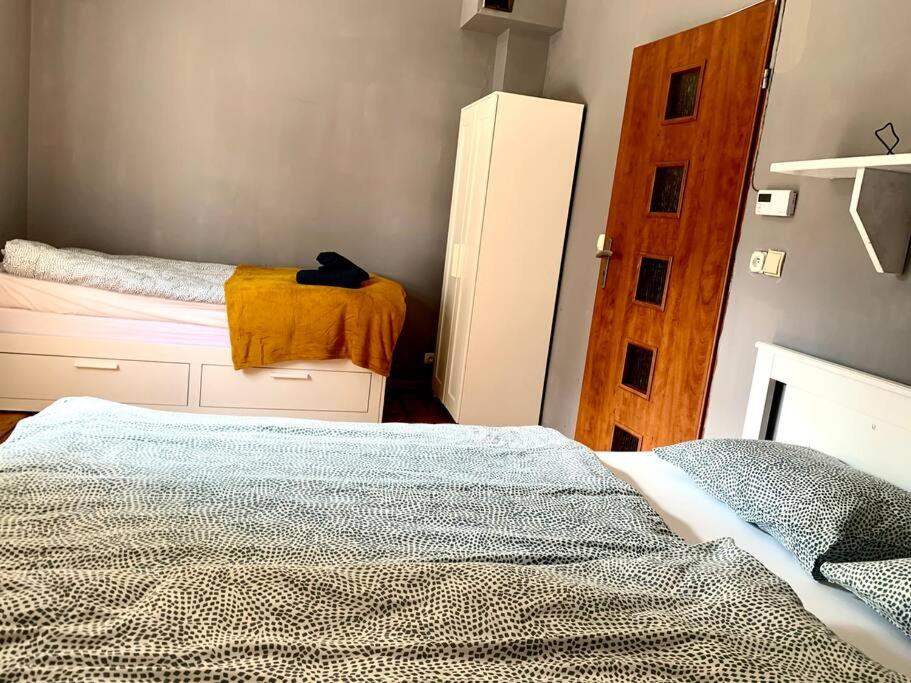 Posteľ alebo postele v izbe v ubytovaní Apartament Krasińskiego 5 - Park