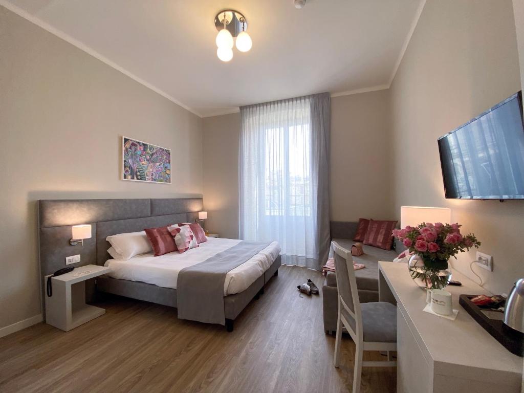 Postel nebo postele na pokoji v ubytování Hotel Eletto