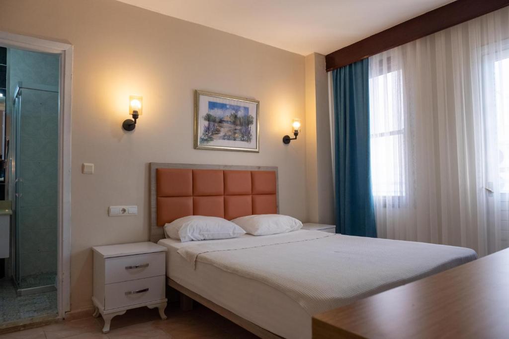 Postel nebo postele na pokoji v ubytování Arden Hotel