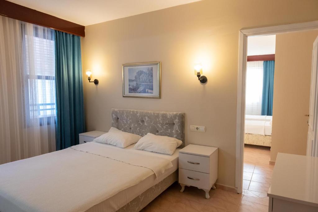 Postel nebo postele na pokoji v ubytování Arden Hotel