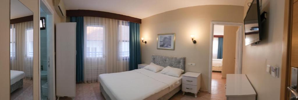 Postel nebo postele na pokoji v ubytování Arden Hotel