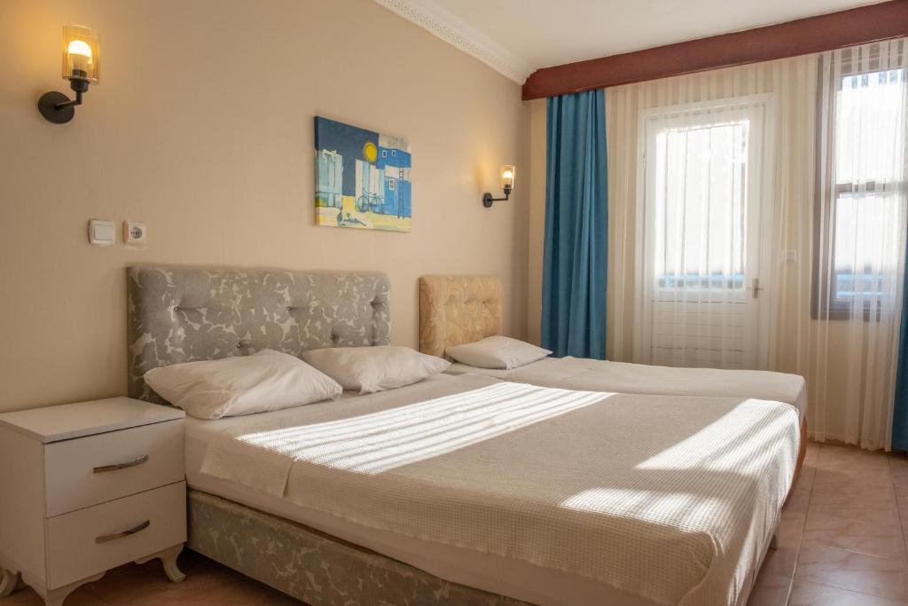 Postel nebo postele na pokoji v ubytování Arden Hotel