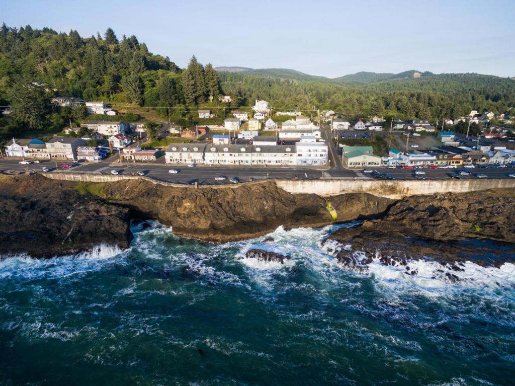 an aerial view of a town on a cliff over the ocean at Bay Echo in Depoe Bay