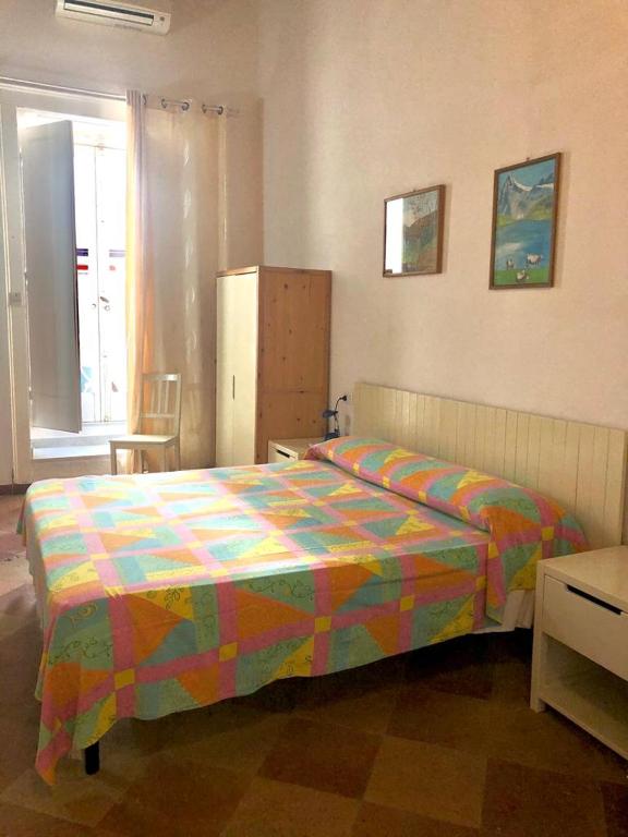 A bed or beds in a room at Rocca Sul Mare Hotel