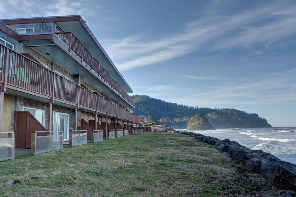 a building on the beach next to the ocean at Pacific Sands Resort # 21 in Neskowin