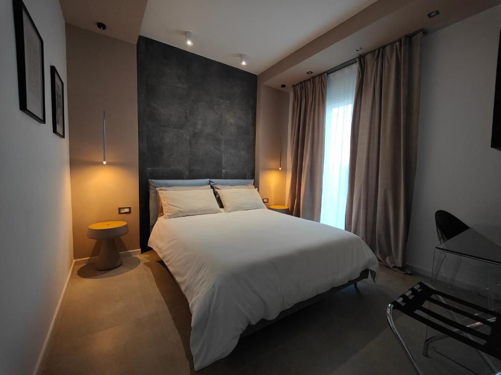 En eller flere senger på et rom på Capricci di Vento - Design Guest House