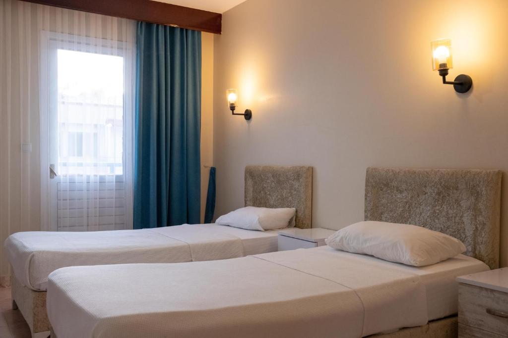 Postel nebo postele na pokoji v ubytování Arden Hotel