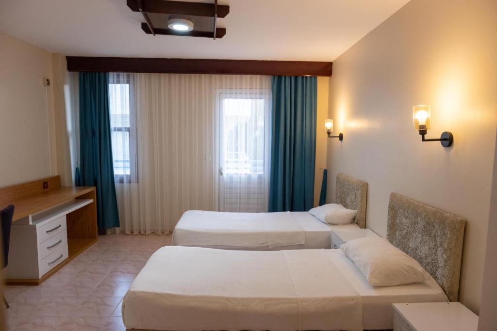 Postel nebo postele na pokoji v ubytování Arden Hotel
