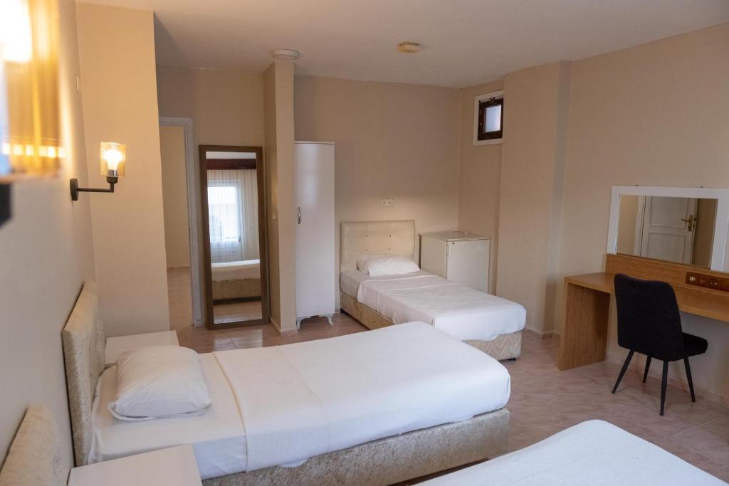 Postel nebo postele na pokoji v ubytování Arden Hotel