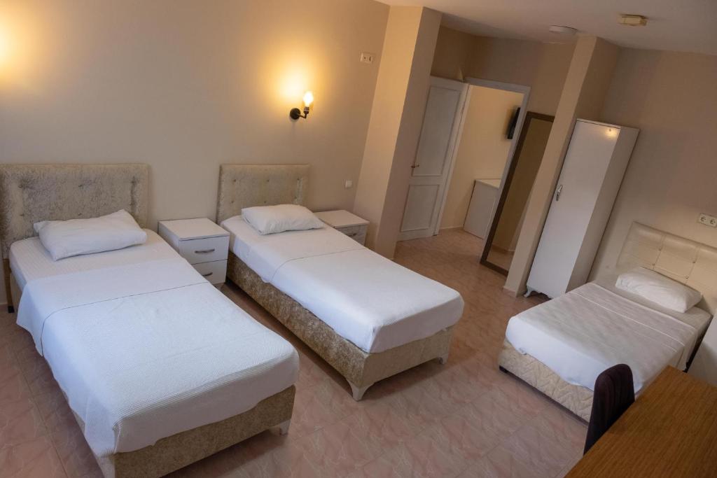 Postel nebo postele na pokoji v ubytování Arden Hotel