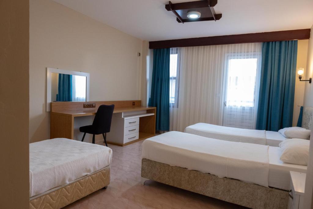 Postel nebo postele na pokoji v ubytování Arden Hotel