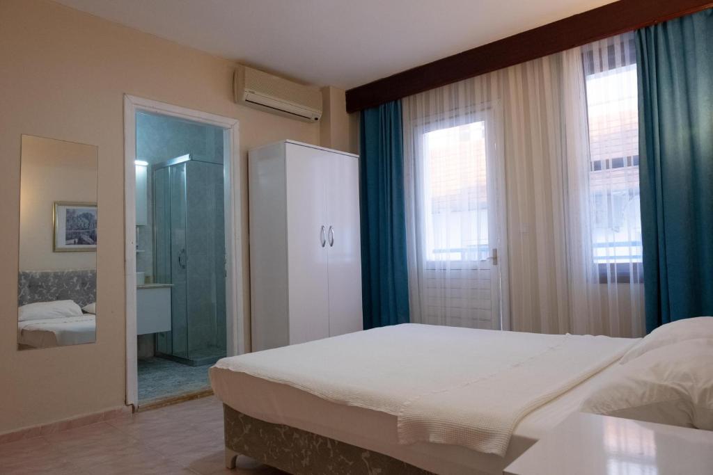 Postel nebo postele na pokoji v ubytování Arden Hotel
