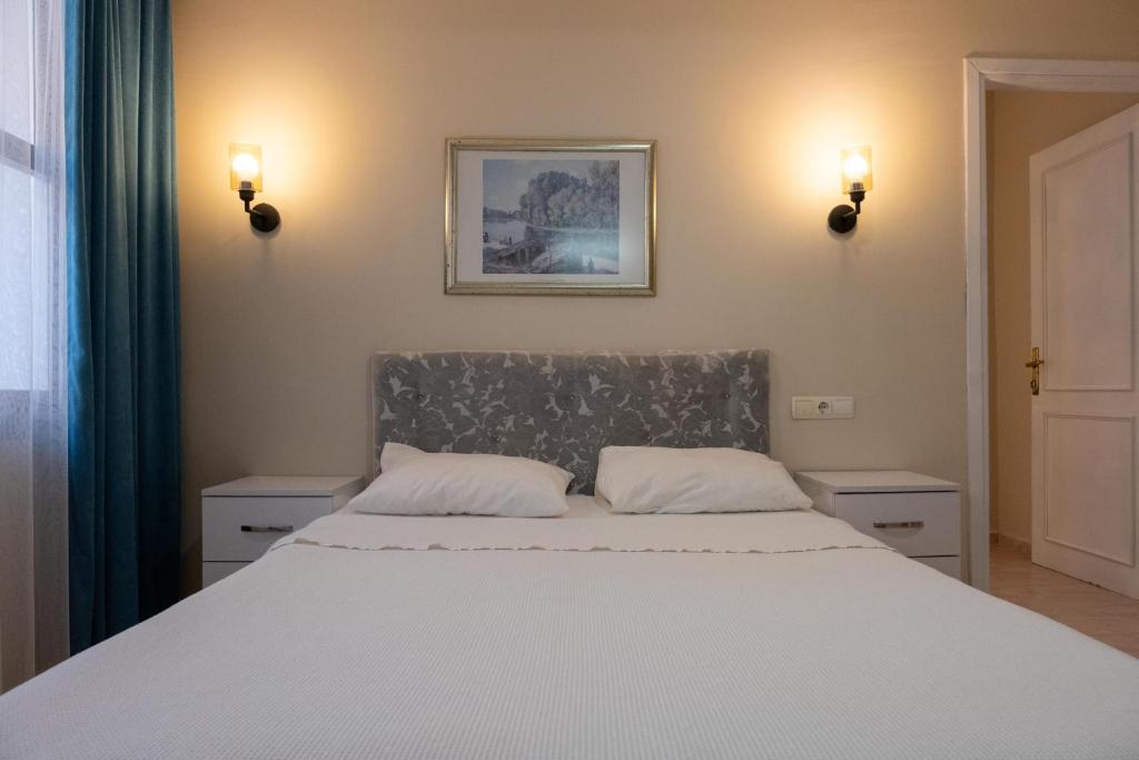 Postel nebo postele na pokoji v ubytování Arden Hotel