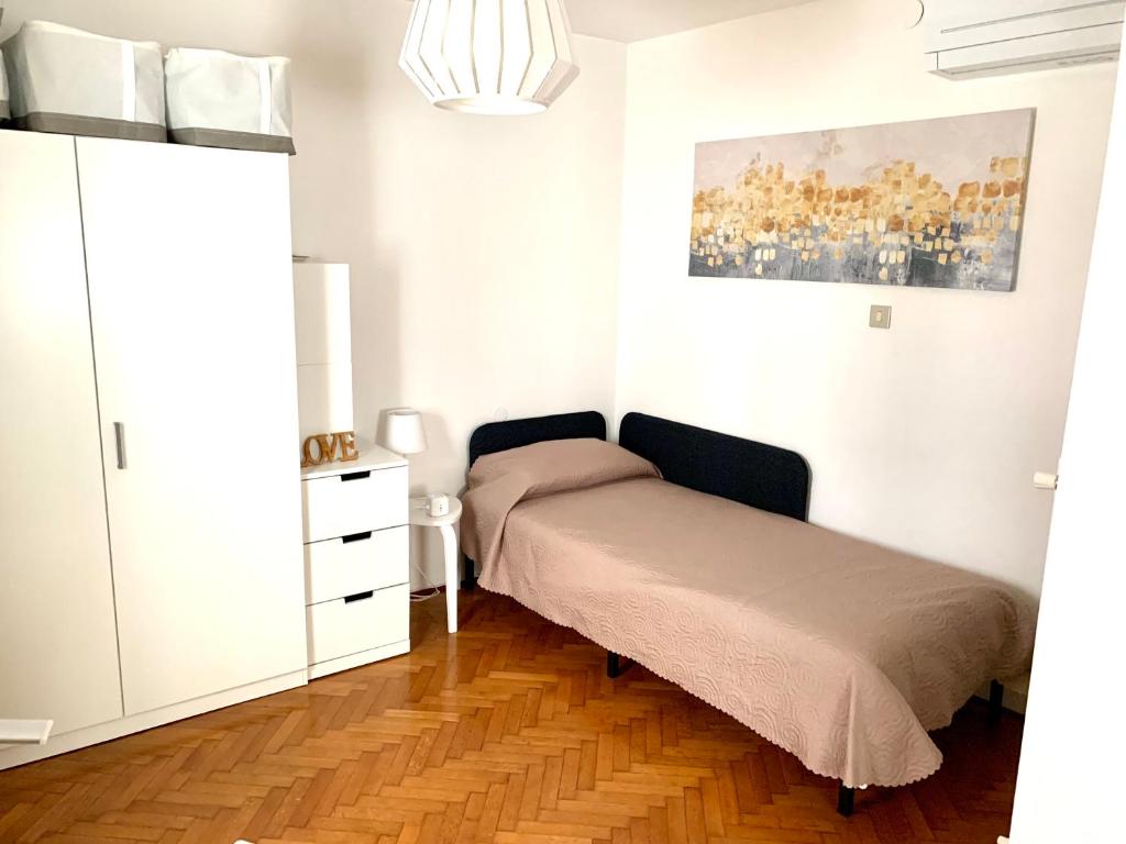Łóżko lub łóżka w pokoju w obiekcie ROOFTOP TERRACE Domus dei fabbri