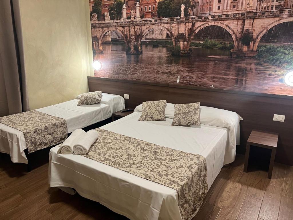 Postel nebo postele na pokoji v ubytování Albergo Corvetto Corso Lodi