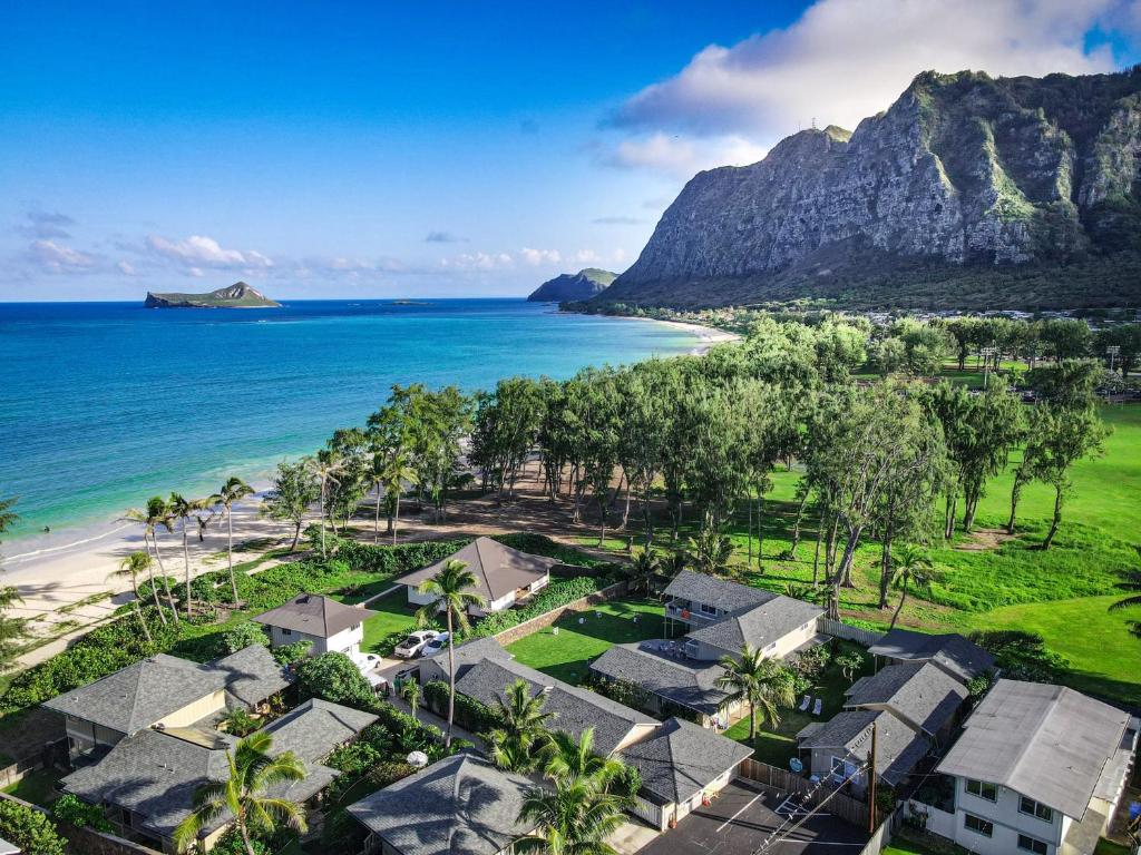 an aerial view of a beach with houses and the ocean at Waimanalo Beach Cottages in Waimanalo