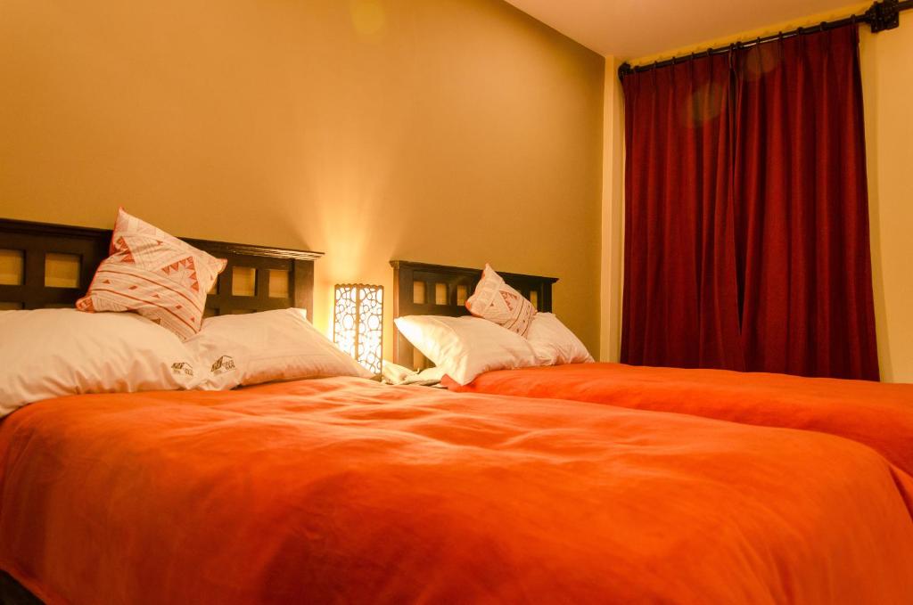 Letto o letti in una camera di Cusco Bed and Breakfast
