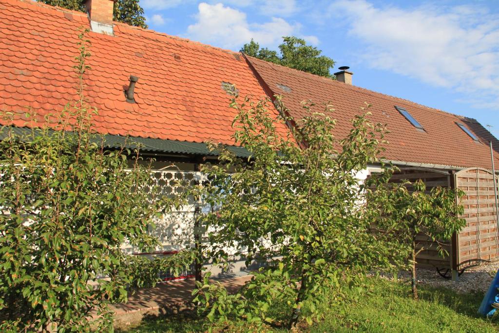 an old brick house with an orange roof at Ferienhaus Landsberg Am Lech in Landsberg am Lech