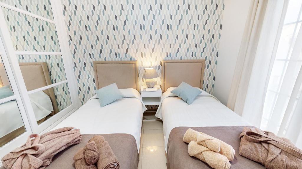 Postel nebo postele na pokoji v ubytování VILLA ANIL Lanzarote