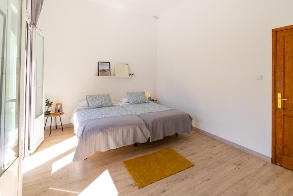 Postel nebo postele na pokoji v ubytování Un Lugar House Canteras - Coliving