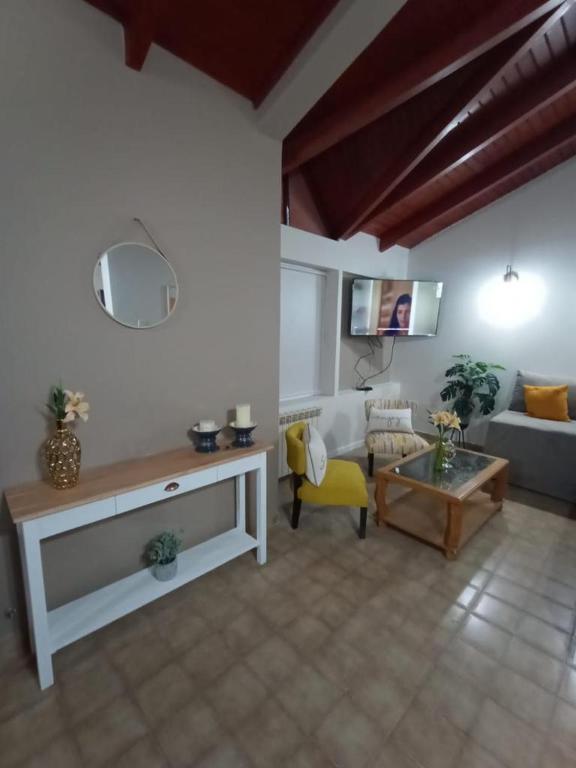 a living room with a couch and a table at BE MAISON USHUAIA in Ushuaia