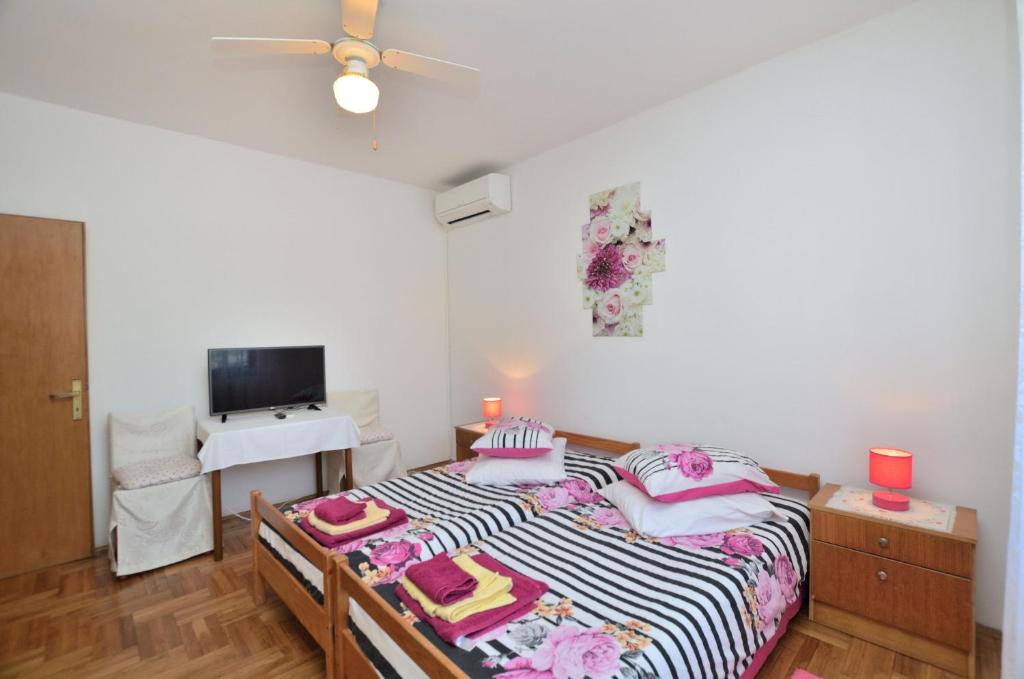 Postel nebo postele na pokoji v ubytování Rooms Tomc