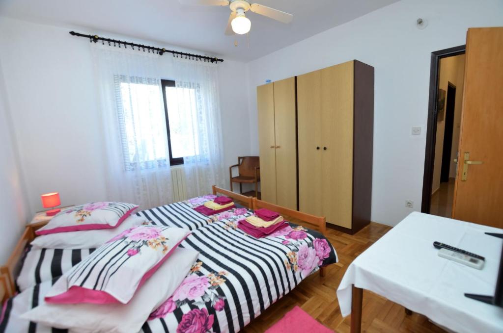 Postel nebo postele na pokoji v ubytování Rooms Tomc