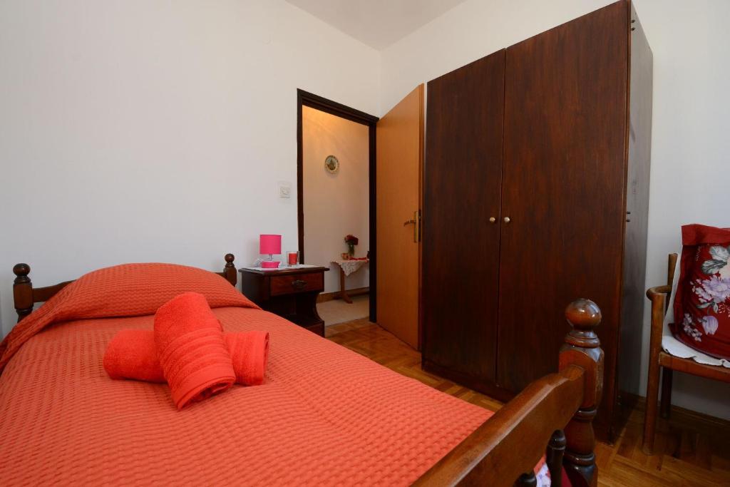 Postel nebo postele na pokoji v ubytování Rooms Tomc