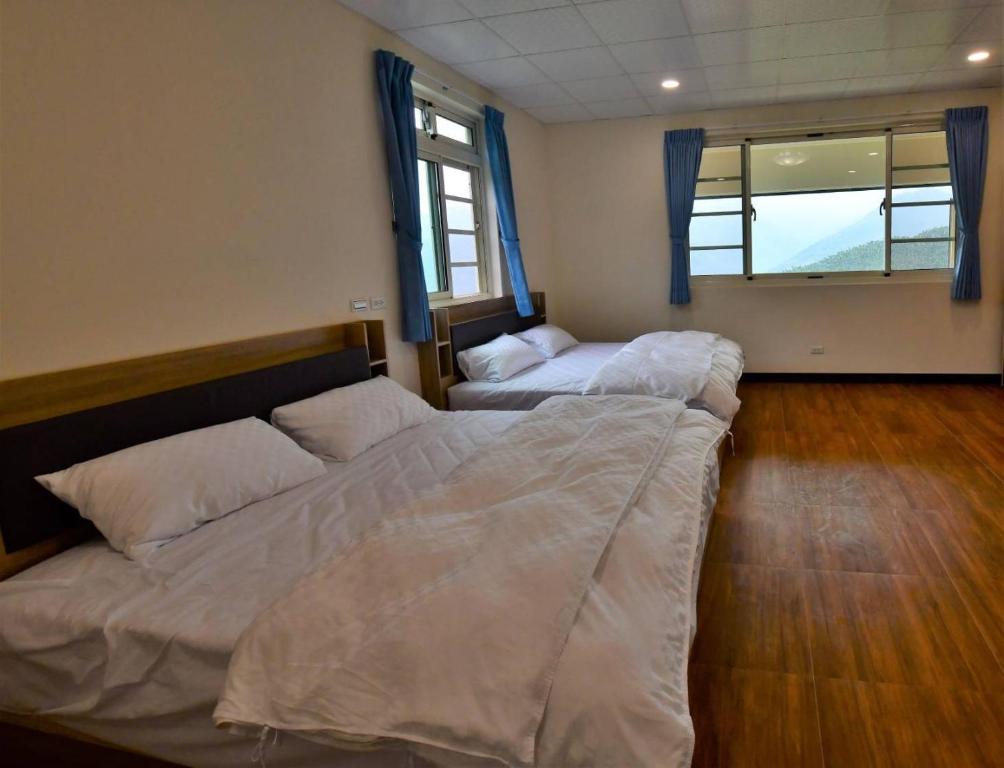 Postel nebo postele na pokoji v ubytování Hongpeng Coffee Station Homestay