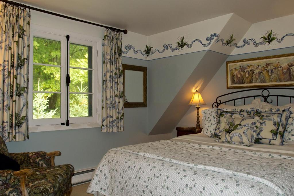 Postel nebo postele na pokoji v ubytování Le Petit Clocher Gite Touristique B & B