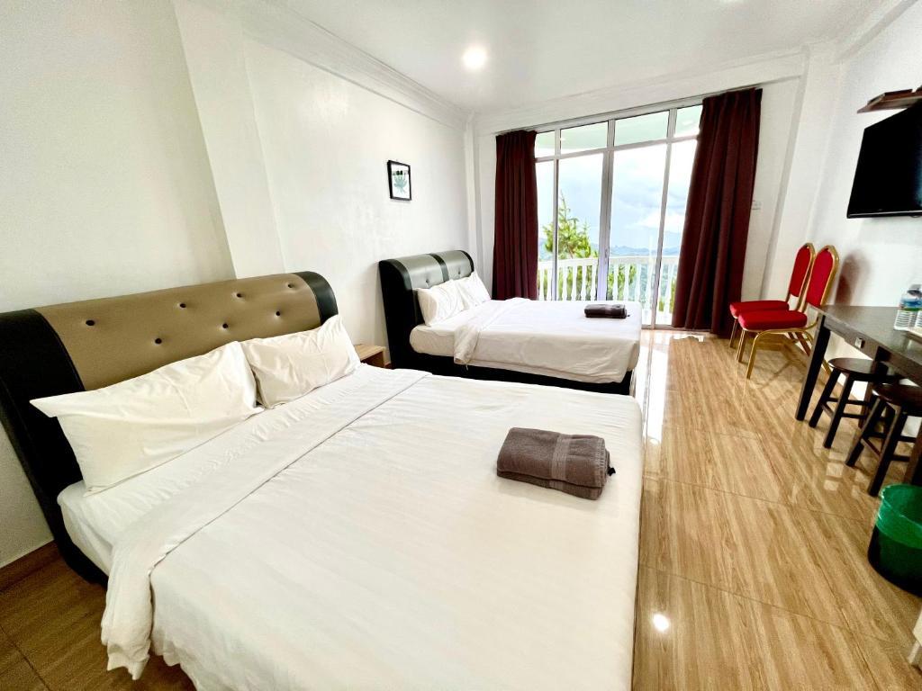Postel nebo postele na pokoji v ubytování JR RESORT