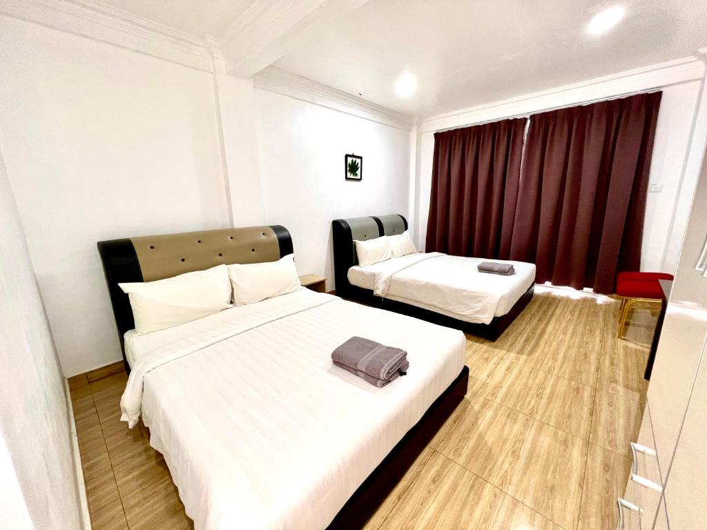 Postel nebo postele na pokoji v ubytování JR RESORT