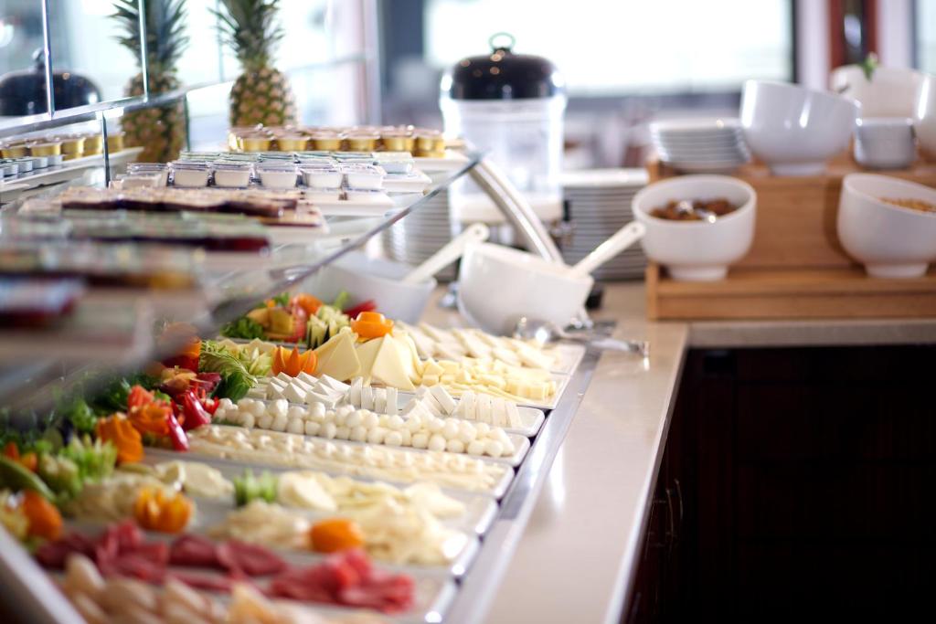 a buffet line with many different types of food at Mosaic Hotel Old City -Special Category in Istanbul