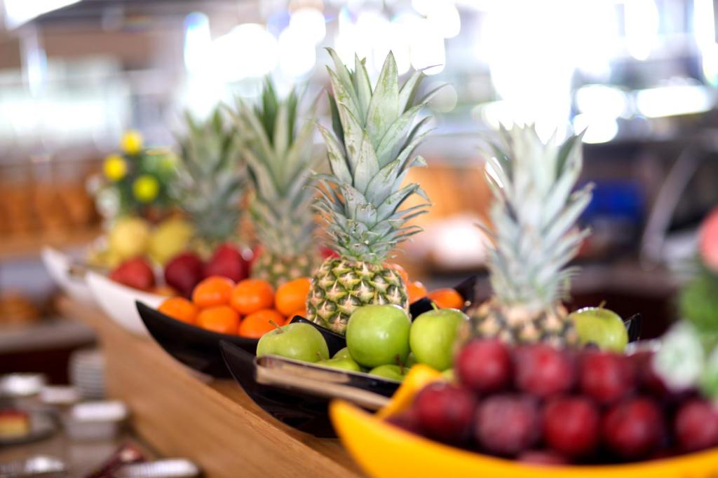 a display of fruit in bowls on a table at Mosaic Hotel Old City -Special Category in Istanbul