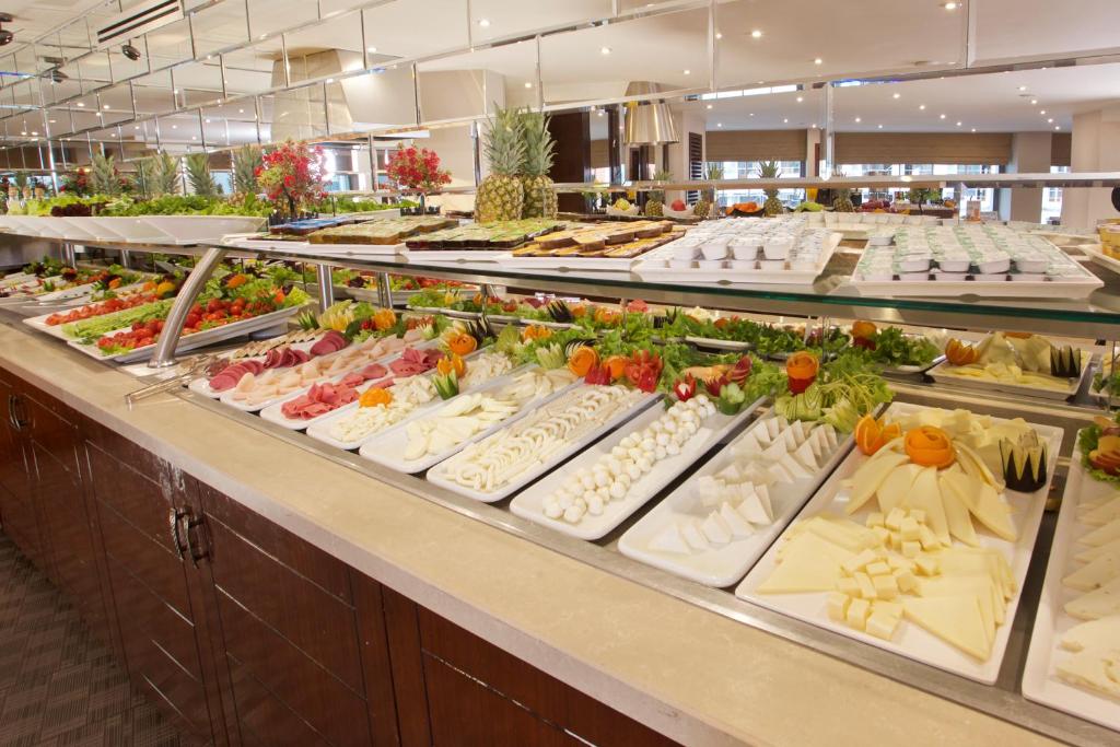 a buffet line with many different types of food at Mosaic Hotel Old City -Special Category in Istanbul
