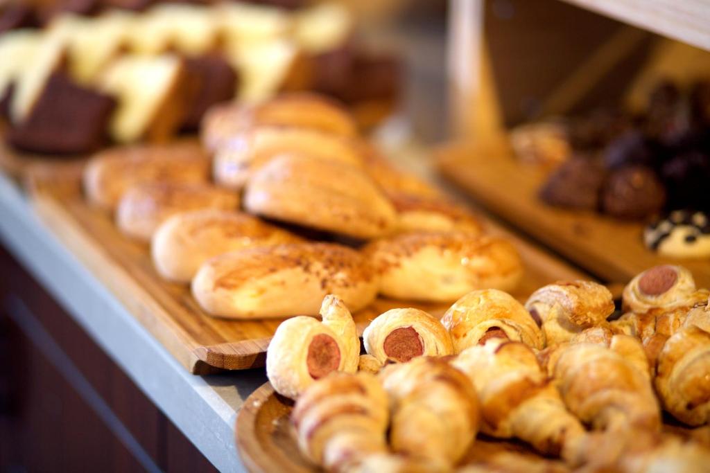 a bunch of different types of breads and pastries on display at Mosaic Hotel Old City -Special Category in Istanbul
